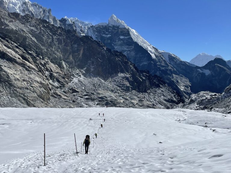 Person hiking on Cho La Glaicer on Three Passes trek in Nepal