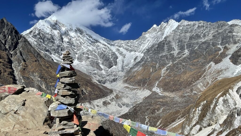 Mountains seen from Tserko Ri with prayer flags in Langtang Valley.